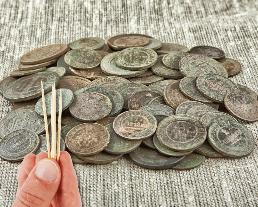 clean old copper coins safely with toothpick and face oil