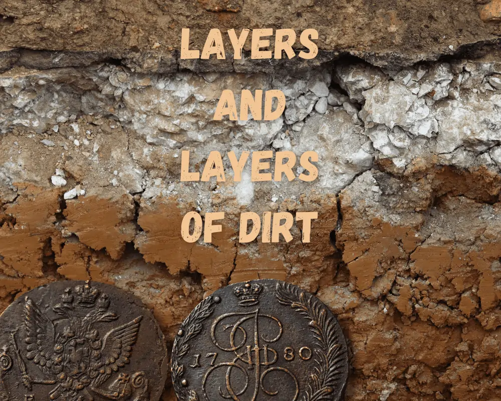 layers of dirt on a copper coin